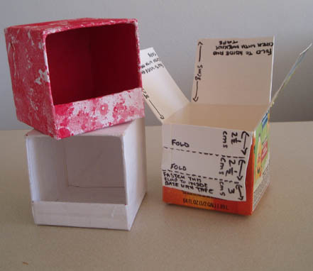 Tidy boxes painted and decorated with bright fabric squares Tidy boxes painted and decorated with bright fabric squares