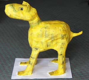 Yellow dog made from newspaper