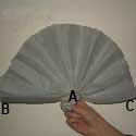 Fan made by folding paper in alternate directions Fan