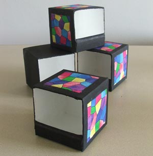 Tidy boxes painted and decorated with bright fabric squares Tidy boxes painted and decorated with bright fabric squares
